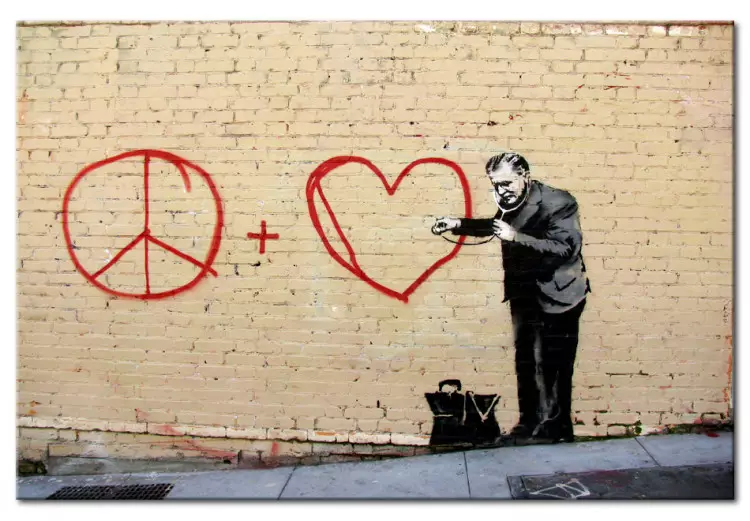 Médecin pacifiste (Banksy) - street art homme sur mur de brique