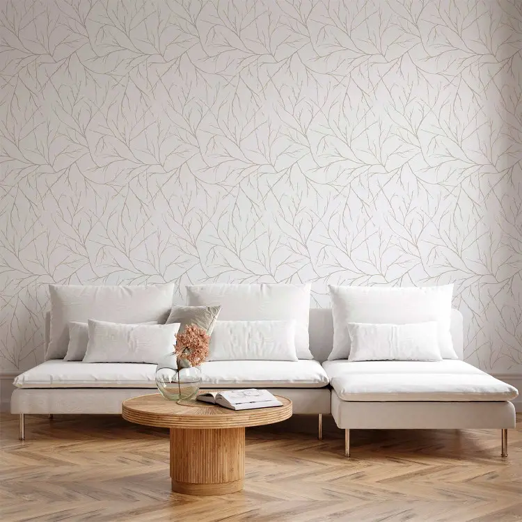 Minimalisme - branches claires entrelacées sur fond blanc